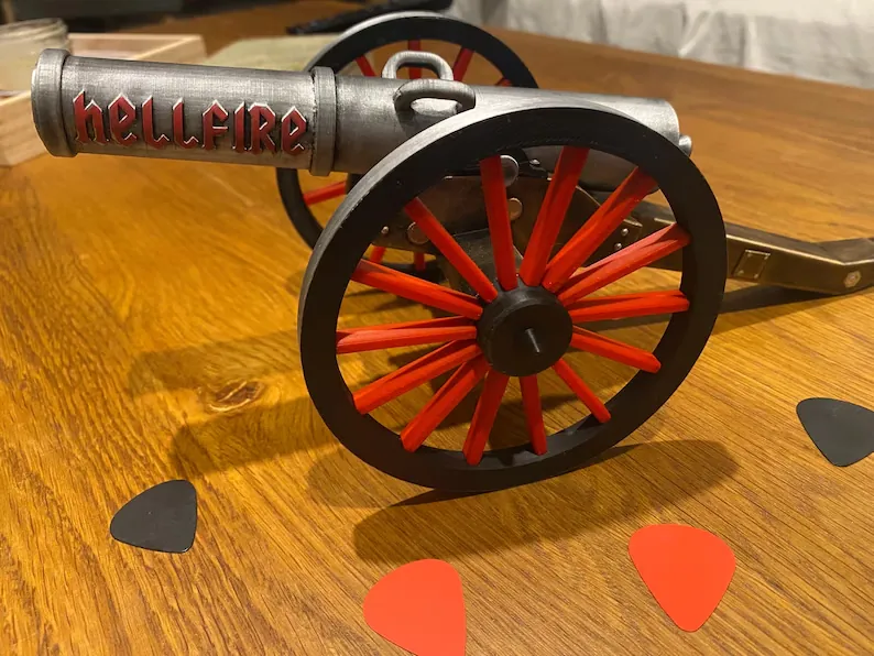 Hellfire Cannon rock decor displayed with guitars